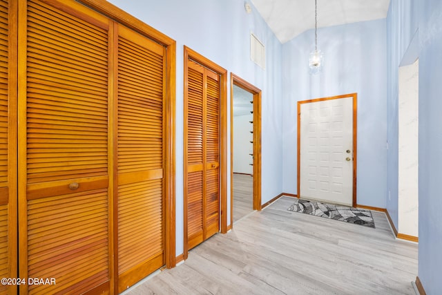 hall with light hardwood / wood-style floors