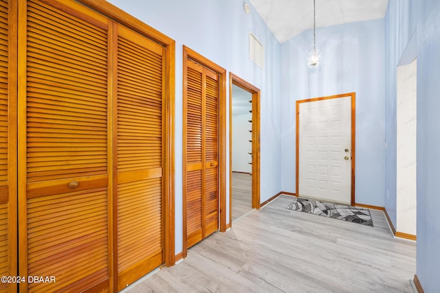212 Glenbriar Cir, Daytona Beach, FL 32114 - entryway with wood finished floors, baseboards, and a high ceiling