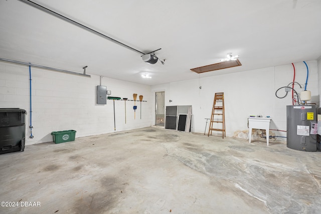 garage with a garage door opener, electric panel, sink, and electric water heater