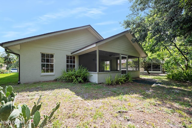 212 Glenbriar Cir, Daytona Beach, FL 32114 - view of property exterior featuring a sunroom