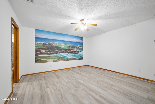 212 Glenbriar Cir, Daytona Beach, FL 32114 - unfurnished room with wood finished floors, ceiling fan, a textured ceiling, and baseboards