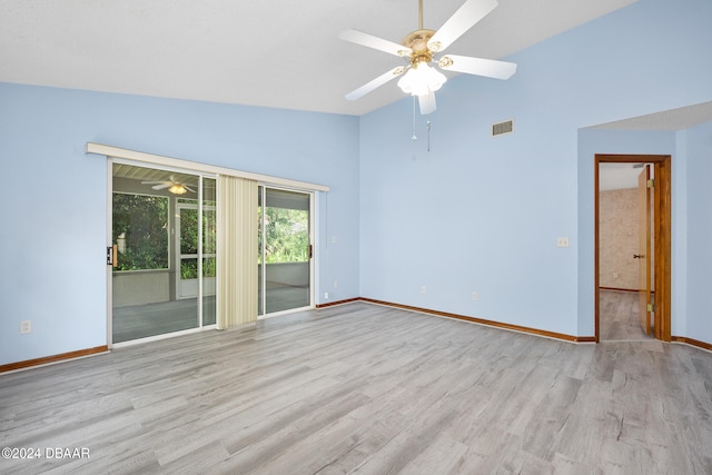 unfurnished room featuring ceiling fan, light wood-type flooring, and vaulted ceiling