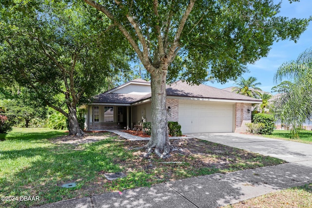 view of front facade with a garage and a front lawn