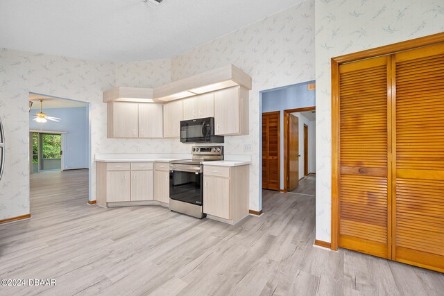 kitchen with stainless steel electric range, light hardwood / wood-style flooring, and ceiling fan