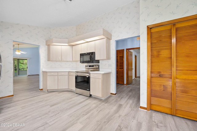 212 Glenbriar Cir, Daytona Beach, FL 32114 - kitchen featuring wallpapered walls, stainless steel electric range oven, black microwave, light countertops, and light wood-style flooring