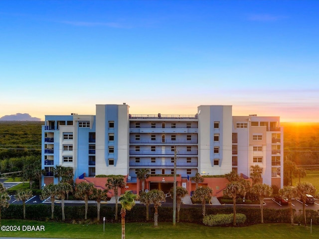 view of outdoor building at dusk