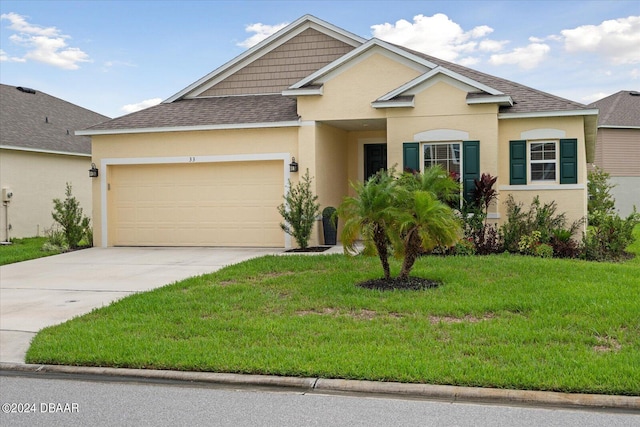 view of front facade featuring a garage and a front yard