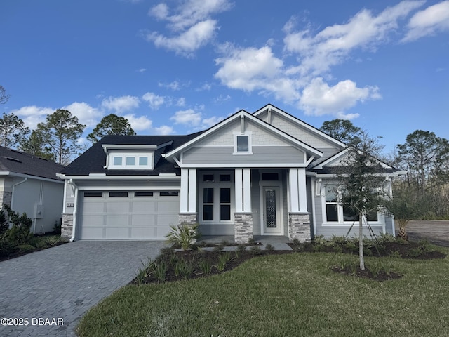 craftsman-style house with a front lawn