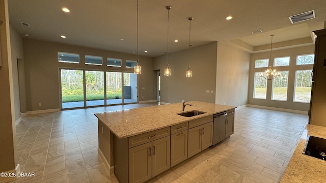 kitchen featuring dishwasher, sink, hanging light fixtures, an inviting chandelier, and light stone counters