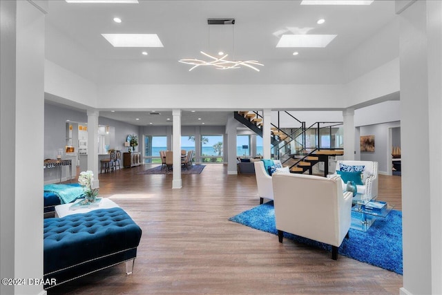 living room with hardwood / wood-style floors and a chandelier