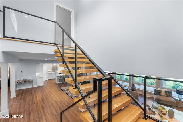 stairway with wood-type flooring