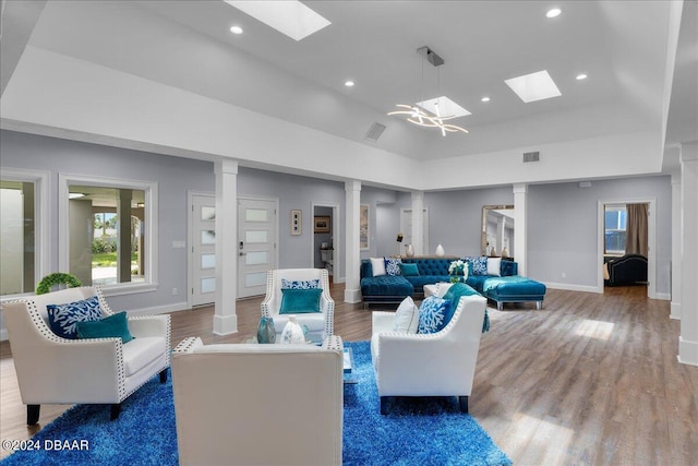 living room featuring dark wood-type flooring and a raised ceiling