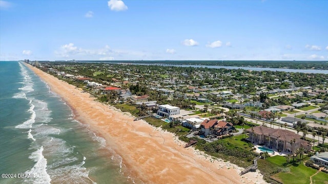 bird's eye view featuring a view of the beach and a water view