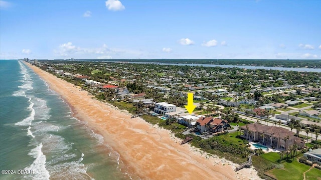 bird's eye view featuring a view of the beach and a water view