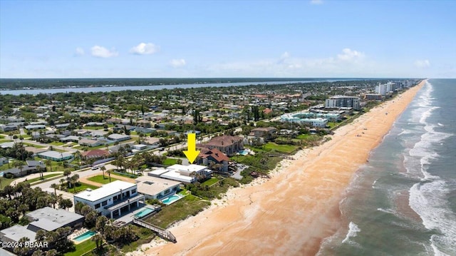 bird's eye view featuring a beach view and a water view