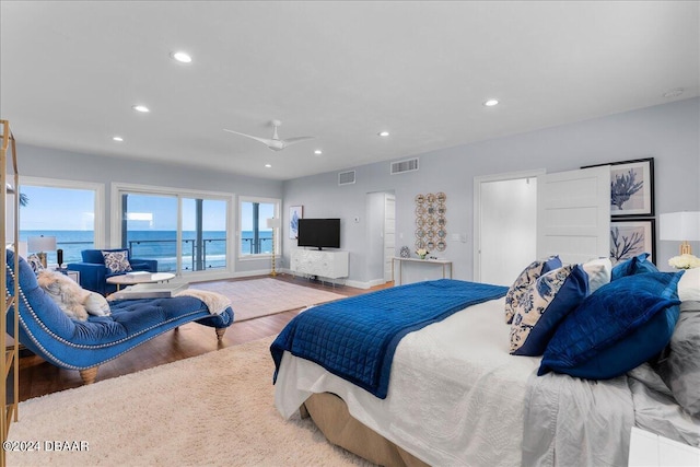 bedroom with hardwood / wood-style floors and ceiling fan