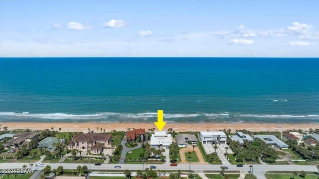 bird's eye view with a view of the beach and a water view