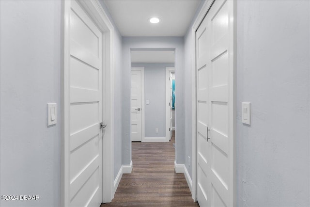 corridor with dark wood-type flooring