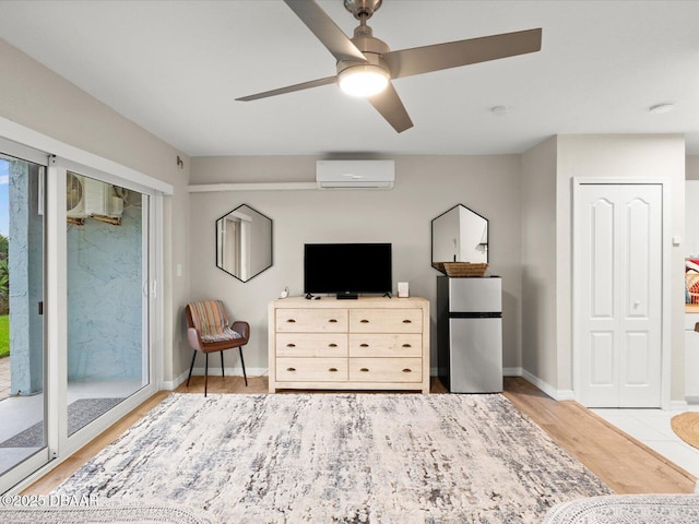 4795 S Atlantic Ave Unit 15, Ponce Inlet, FL 32127 - bedroom with a wall unit AC, freestanding refrigerator, access to exterior, wood finished floors, and ceiling fan