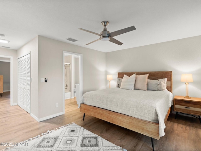 4795 S Atlantic Ave Unit 15, Ponce Inlet, FL 32127 - bedroom with wood finished floors, connected bathroom, and ceiling fan