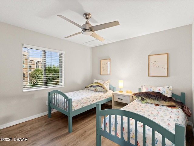 4795 S Atlantic Ave Unit 15, Ponce Inlet, FL 32127 - bedroom with wood finished floors and a ceiling fan