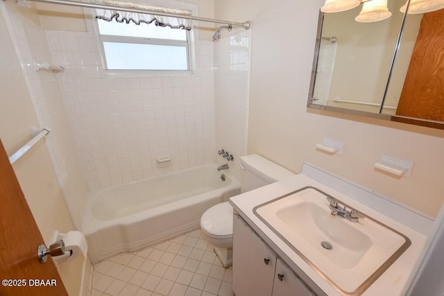 full bathroom with tiled shower / bath combo, vanity, tile patterned flooring, and toilet