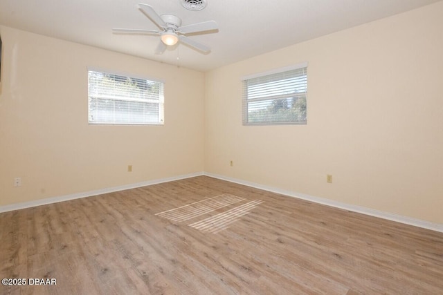 unfurnished room with ceiling fan and light hardwood / wood-style flooring