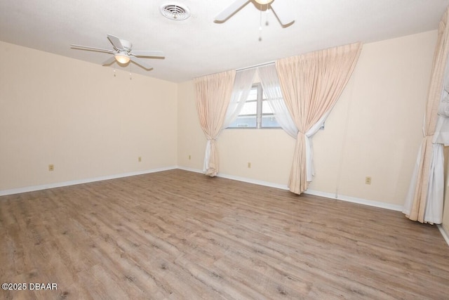 spare room with ceiling fan and light hardwood / wood-style floors