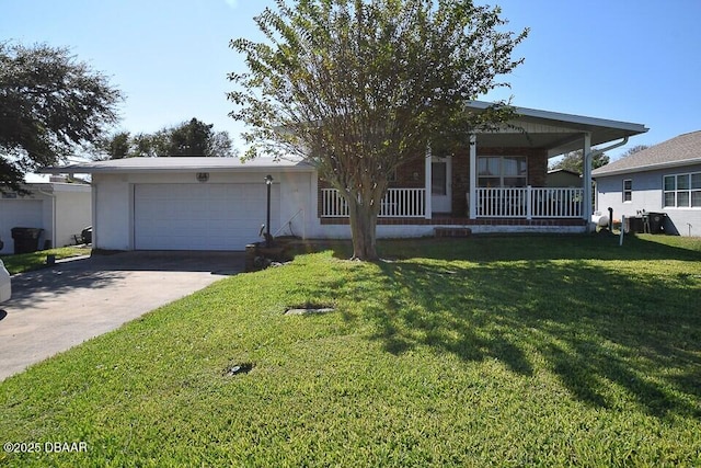 ranch-style house featuring a garage, a front yard, and covered porch