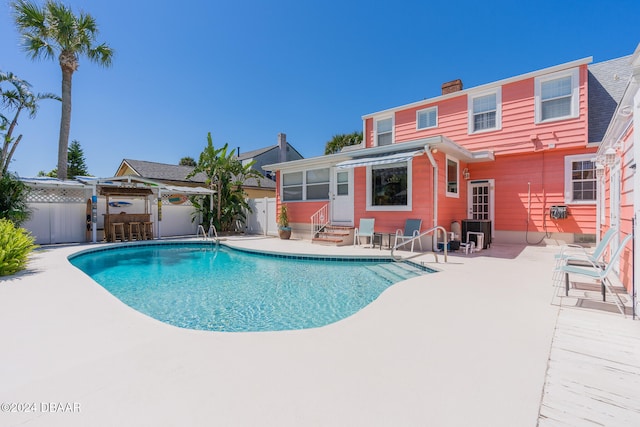 view of swimming pool with a patio