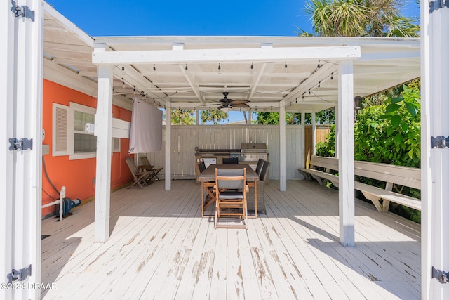 deck featuring a grill and ceiling fan