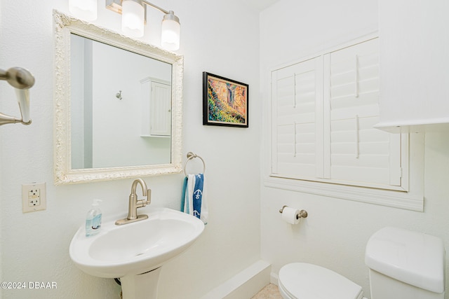 bathroom with toilet and sink