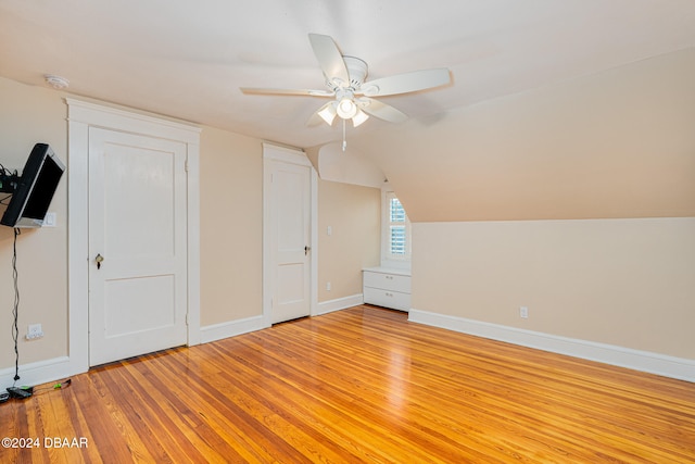 bonus room with light hardwood / wood-style flooring, ceiling fan, and lofted ceiling