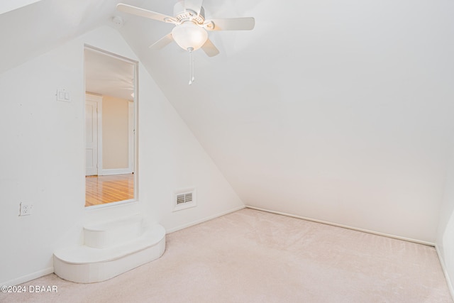 bonus room with light colored carpet, ceiling fan, and lofted ceiling