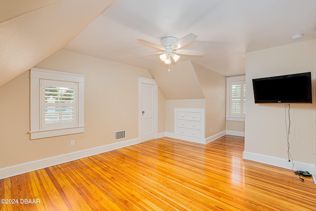 bonus room featuring ceiling fan, wood-type flooring, and vaulted ceiling