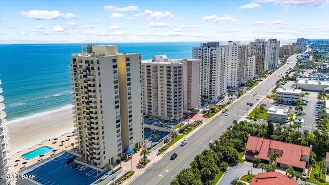 bird's eye view with a city view, a beach view, and a water view