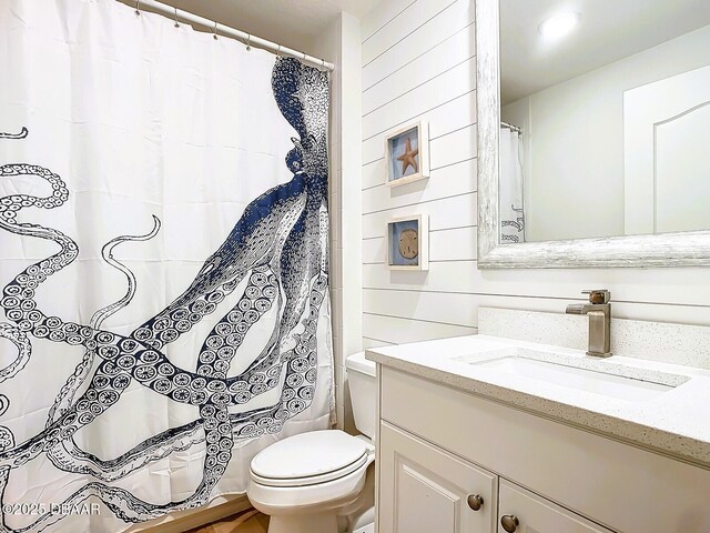 bathroom with vanity, hardwood / wood-style floors, and independent shower and bath