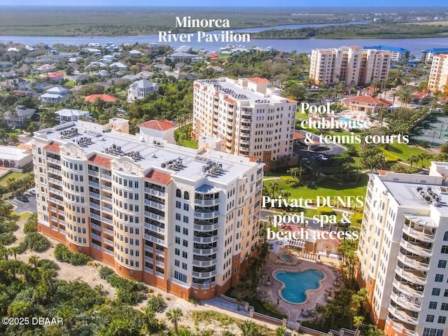 birds eye view of property featuring a water view and a city view