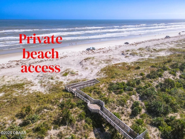 drone / aerial view with a view of the beach and a water view