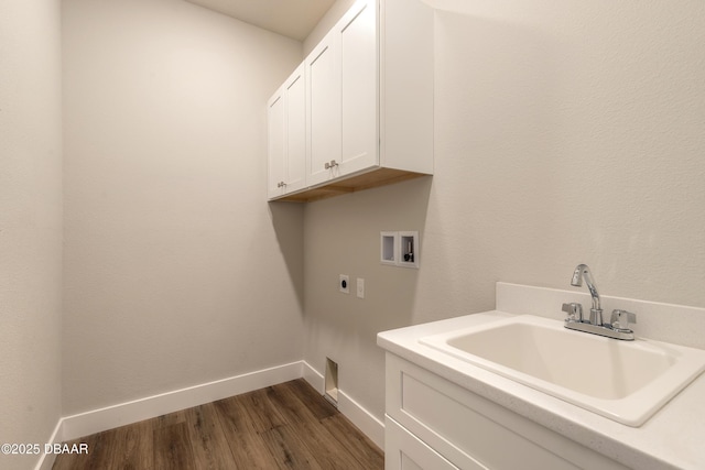 washroom featuring hookup for an electric dryer, washer hookup, cabinets, dark wood-type flooring, and sink