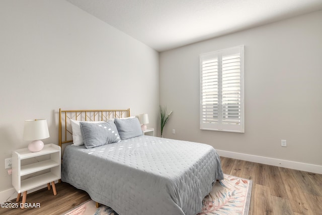 bedroom with light wood-type flooring