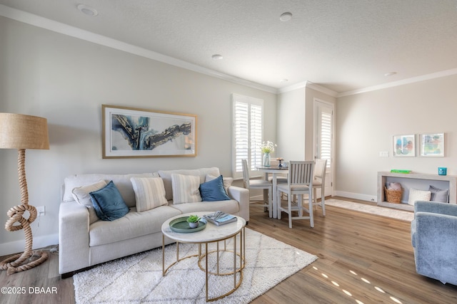 living room with crown molding, a textured ceiling, and hardwood / wood-style flooring