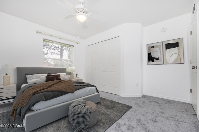bedroom with a ceiling fan, baseboards, carpet, and a closet
