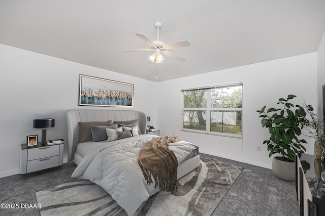 bedroom featuring baseboards, ceiling fan, and dark carpet