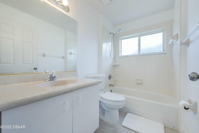 bathroom featuring shower / bathtub combination, toilet, and vanity