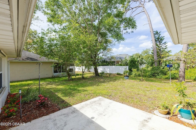 view of yard featuring a patio area and fence