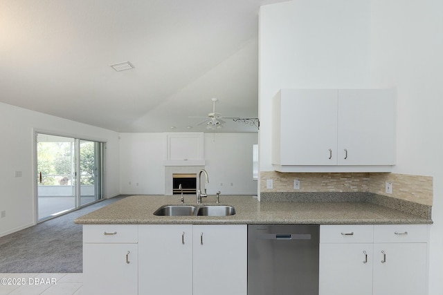 kitchen with a ceiling fan, dishwasher, a sink, white cabinets, and open floor plan