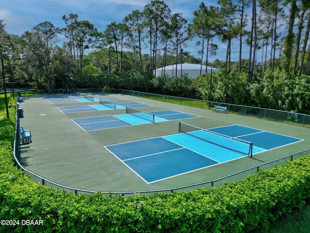 view of tennis court featuring fence