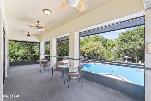 exterior space featuring ceiling fan and a patio area