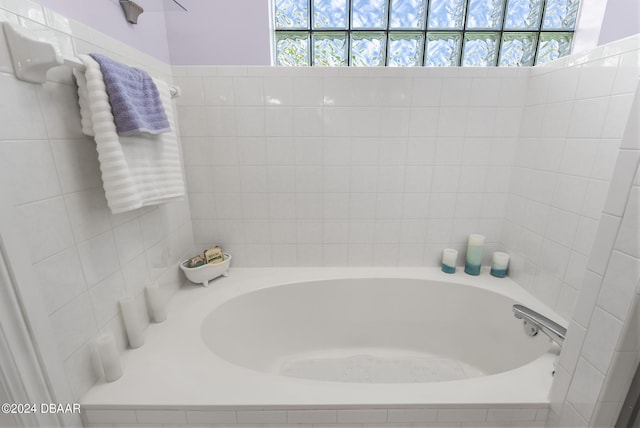 bathroom with a tub